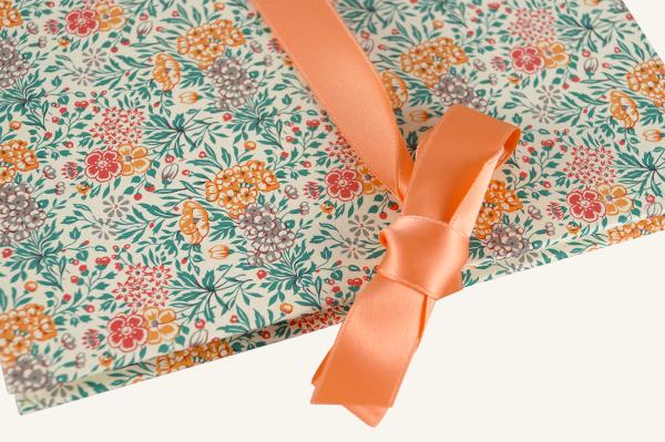 Leporello with floral pattern in orange and red satin bow
